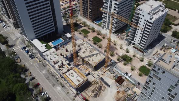 Top down view of a Construction site between Large Apartment Buildings