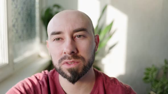 Portrait of a Young Man Leading a Live Broadcast Communicating with His Subscribers