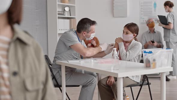 School-aged Girl Getting Vaccine Injection