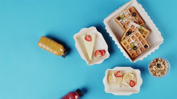 Food Delivery Top View Take Away Breakfast in Disposable Containers on Blue Background