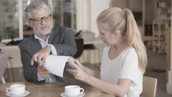 Bearded Caucasian Executive Manager Holding Clipboard