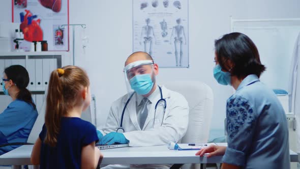 Doctor Talking with Little Girl