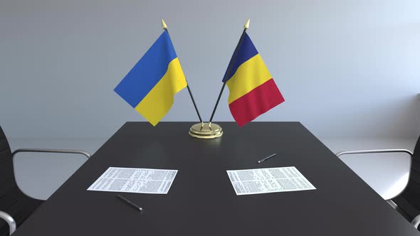 Flags of Ukraine and Romania and Papers