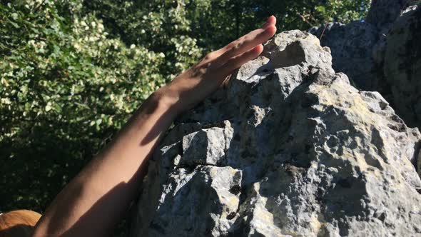 Woman ascends on dangerous cliff 4K 2160p 30fps UltraHD footage - Female on top of the rock 3840X216