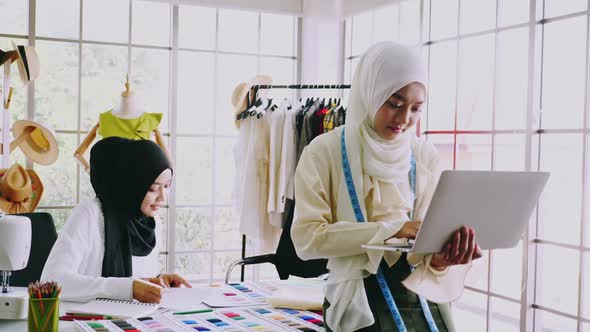 Muslim women fashion designers are in process of creating new clothes collection.