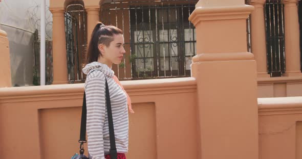 Caucasian woman walking in the street