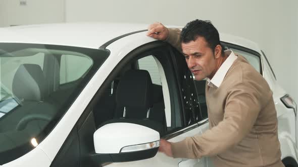 The Attentive Man Went To the Window of the Car and Examined the Car's Interior