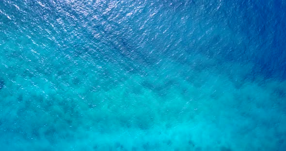 Wide angle overhead copy space shot of a summer white paradise sand beach and aqua blue ocean 