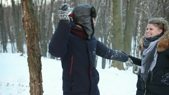 Pair Having Snowball Fight