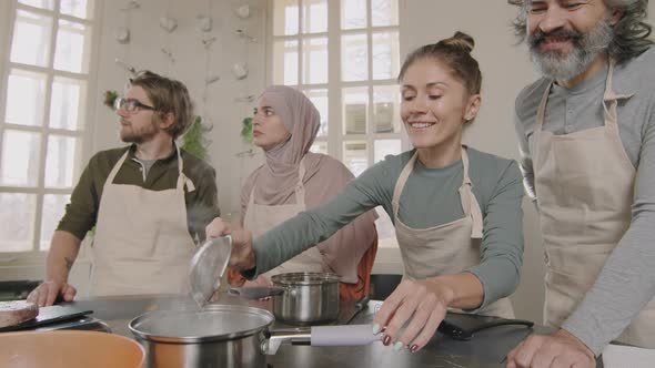 Woman Cooking Poached Egg For First Time