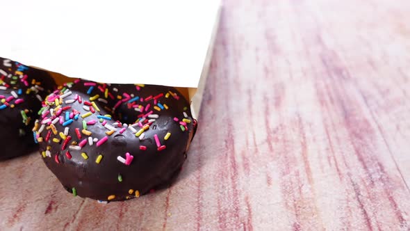 Chocolate Donuts in a Packet on Table