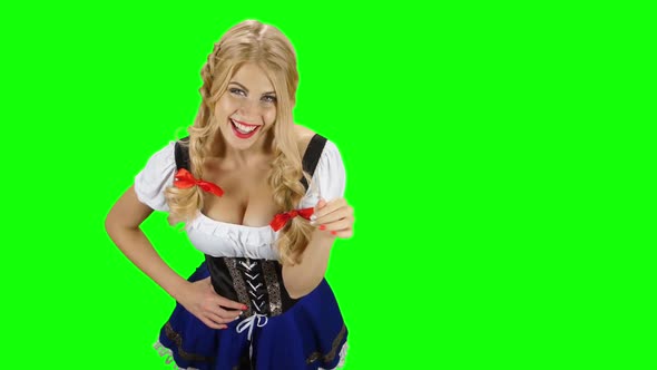 Woman in Traditional Costume Offers a Glass of Beer on Oktoberfest, Green Screen