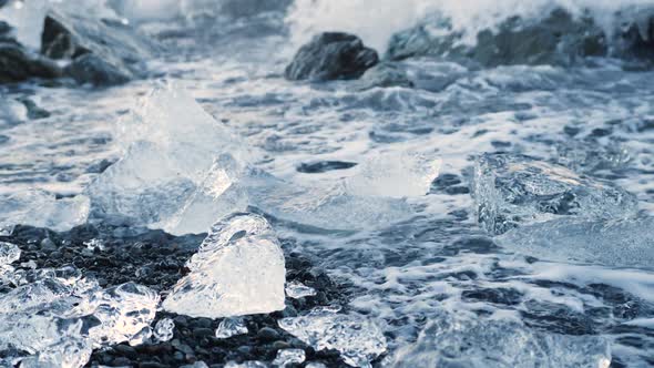Chunks of Ice on Black Sand Global Warming Climate Change Concept Icebergs in Jokulsarlon Glacier