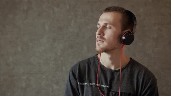 Young man listens to music 