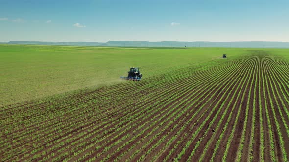 Tractor Cultivating Field At Spring, Aerial View. 