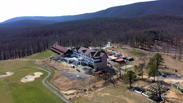 Aerial pull back view of Cacapon State Park lodge expansion project on the golf course and its seren