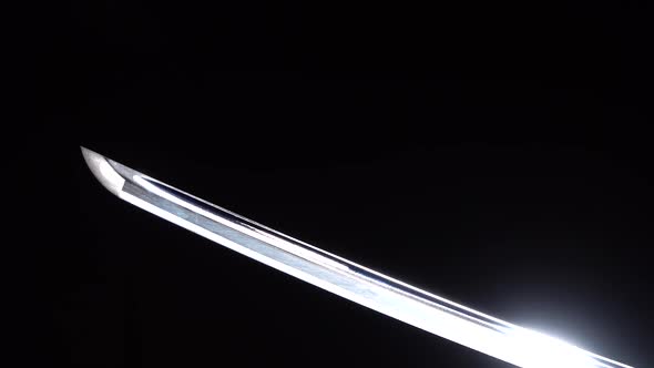 Dramatic Studio Shot of Man Holding Samurai Sword. Close Up