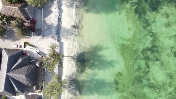 Vertical Video Boats in the Ocean Near the Coast of Zanzibar Tanzania Aerial View