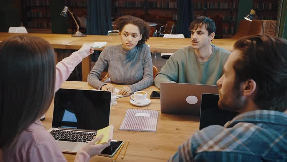 Young Woman Leader Hold Business Training Within Multicultural Staff Group