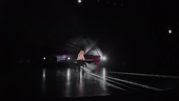 Young Pianist Playing Solo on Stage