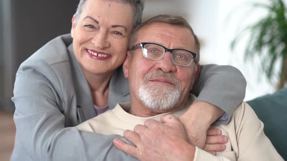 Indore Portrait of a Grayhaired Elderly Married Couple a Man and a Woman Hugging and Looking at the