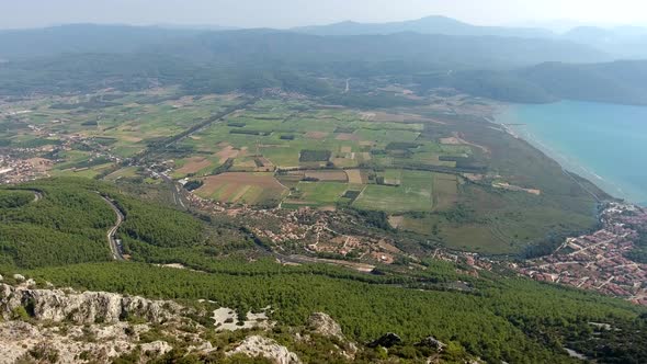 A Small City on a Forested Bay and Fertile Alluvial Plain by the Sea