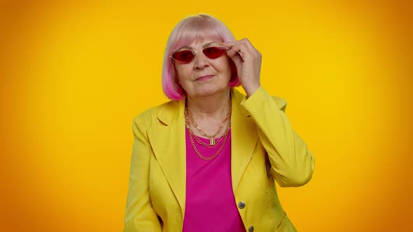 Portrait of Seductive Senior Elderly Old Granny Stylish Woman Wearing Red Sunglasses Charming Smile