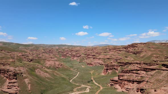 red fairy chimneys mountains and green valley