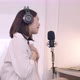 Beautiful Young Asian female influencer talking into a microphone while recording a podcast. - VideoHive Item for Sale