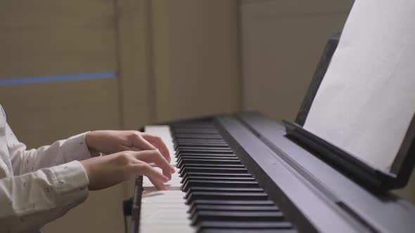 Little Girl Playing the Piano