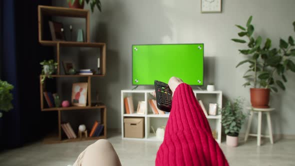 Woman Watching Television with Chroma Green Screen