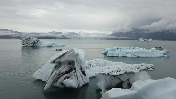 An aerial footage of a speedboat in jokulsarlon glacier lagoon