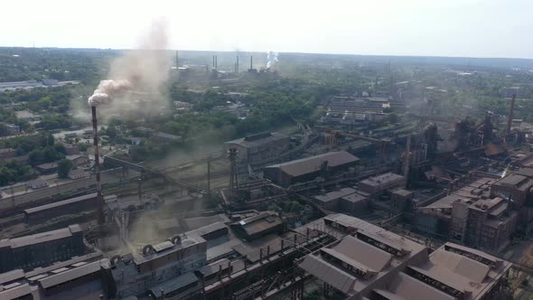 Smoke From The Plant Pipes Above The City Buildings 