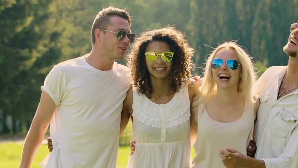 Cheerful Young People Dancing to Music, Laughing and Hugging, Enjoying Summer