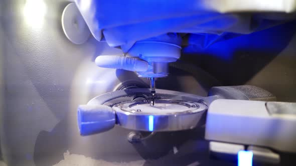 Close up of dentist working. Laboratory milling cutter for dental work