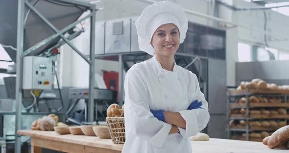 Cute Baker Woman in Front of the Camera Looking