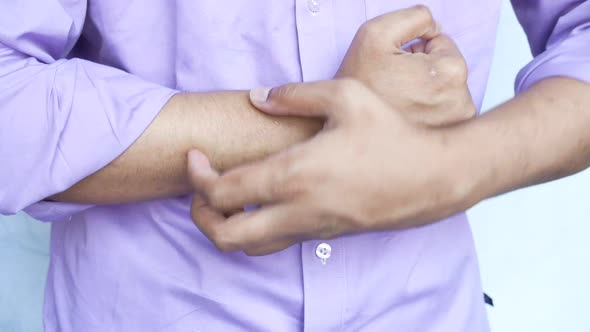 Man Suffering From Itching Skin Close Up