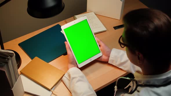 Doctor Using Gadget Tablet with Green Chroma Key Screen