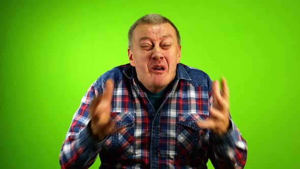 Angry Mature Adult Caucasian Stressed Man Yelling Screaming and Actively Gesturing