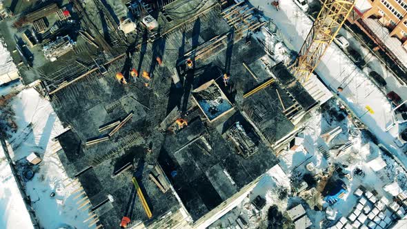 Urban Building Lot with Workers in a View From Above