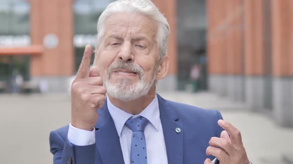 Outdoor Portrait of Yelling Angry Old Businessman