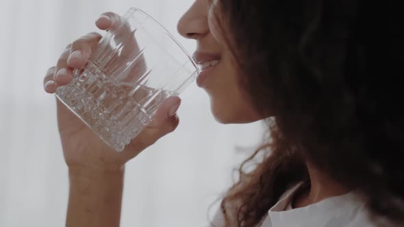 Close Up Profile Portrait of a Young Woman Drinking Water