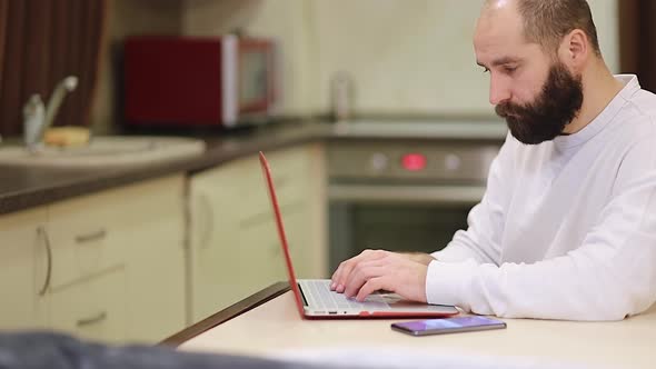 Focused business man entrepreneur typing on laptop doing research