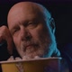 Senior man watching a boring movie at the cinema and eating popcorn, he is falling asleep - VideoHive Item for Sale