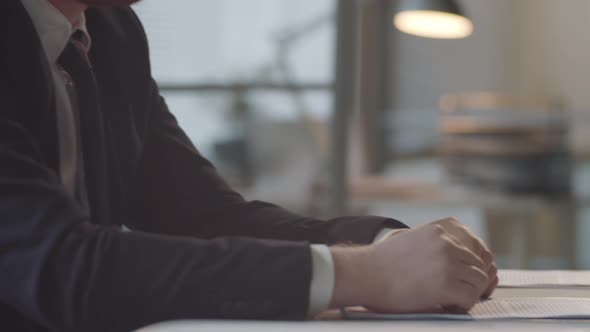 Diverse Men Talking and Shaking Hands at Business Meeting