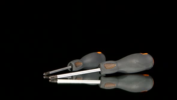 Gray Screwdrivers on Black, Reflection, Rotation, Close Up