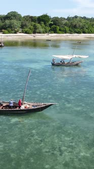 Vertical Video Boats in the Ocean Near the Coast of Zanzibar Tanzania