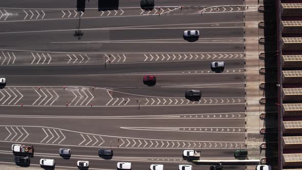 Cars on Lanes Stopping and Paying at Tolls