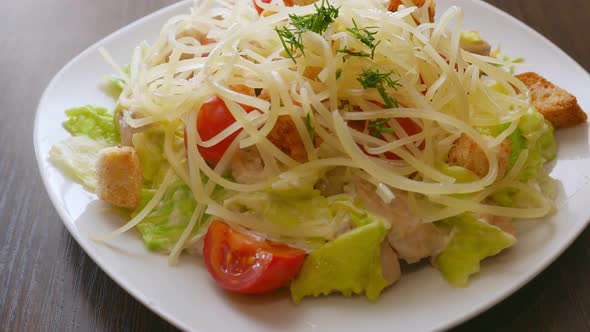 Caesar Salad with Chicken Meat Lettuce and Parmesan Cheese