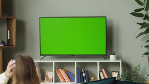 Woman Watching Television with Chroma Green Screen